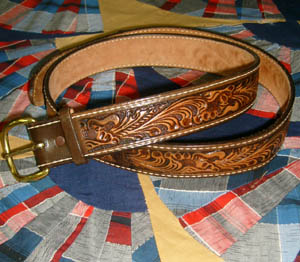 (44) vintage Tooled Leather Belt w/ brass buckle (can come off) Nice designs, has name area